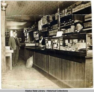 Seward Commercial Company General Store. William Sauers at right.